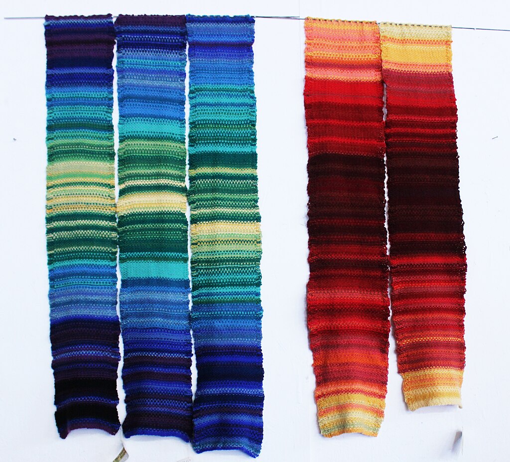 Five woven tapestries in blues and reds, based on the original climate stripes. 