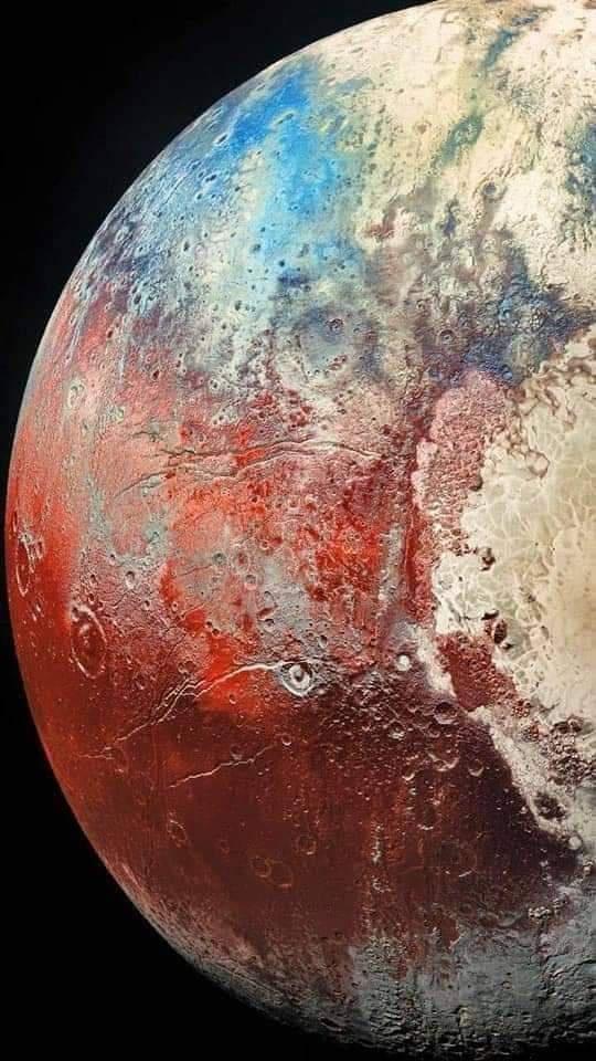 A photo showing half of Pluto. Distinct craters and other geographical features are clearly visible. The surface of the planet is coloured in shades of red, blue, and grey. 