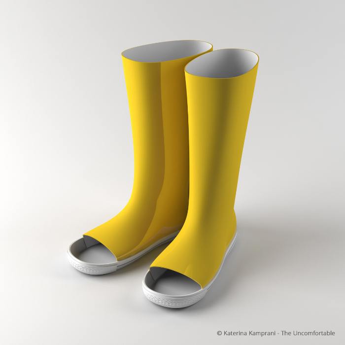 A pair of yellow rubber boots. The boots have been constructed with holes over the toes. 
